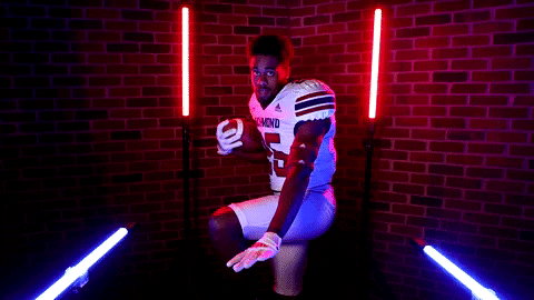 Funny Footballer Striking The Heisman Pose GIF