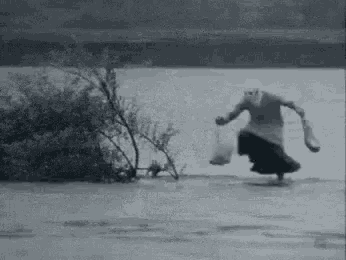 Funny Granny Holding Groceries Dancing In The Rain GIF
