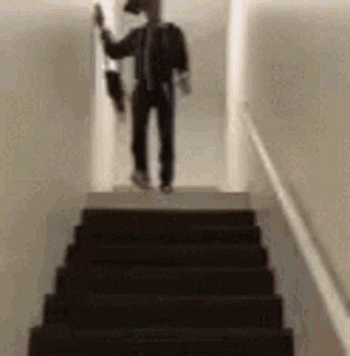 Funny Guy Ready To Go Out Falling Down Stairs GIF