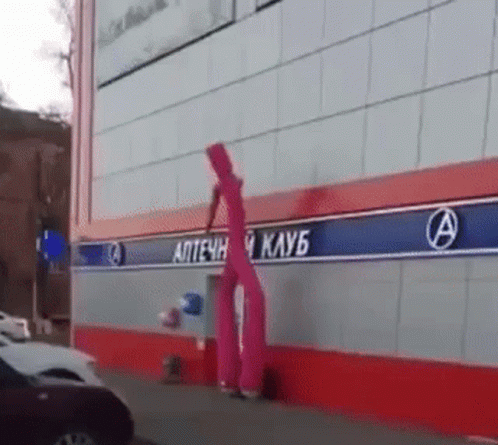 Funny Inflatable Tube Man Bumping Head On Wall GIF