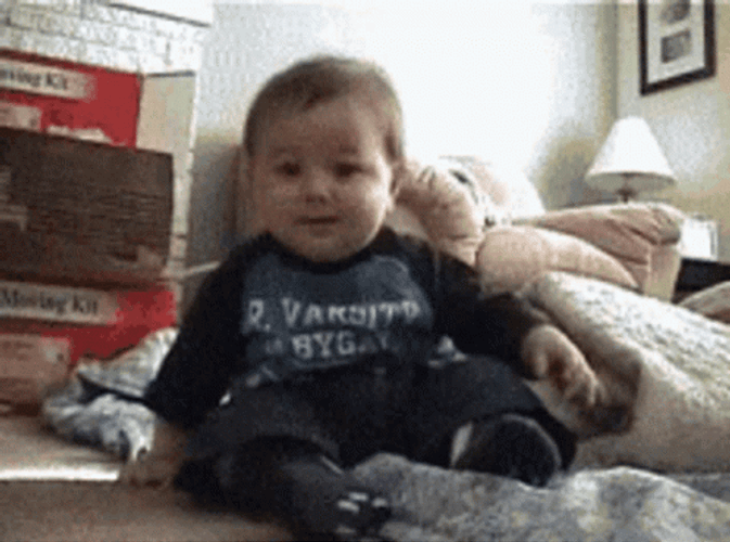 Funny Laughing Baby Rolling On Floor GIF