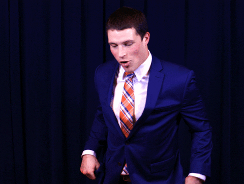 Funny Man Making Wacky Heisman Pose GIF