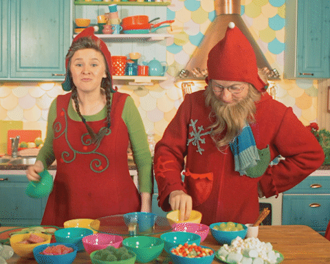 Funny Mister And Mrs Santa Cooking GIF