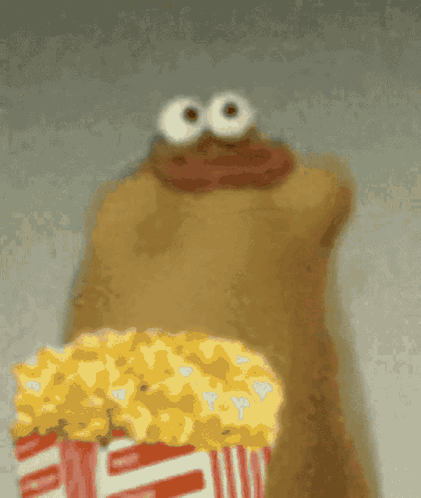 Funny Puppet Eating Popcorn Meme GIF