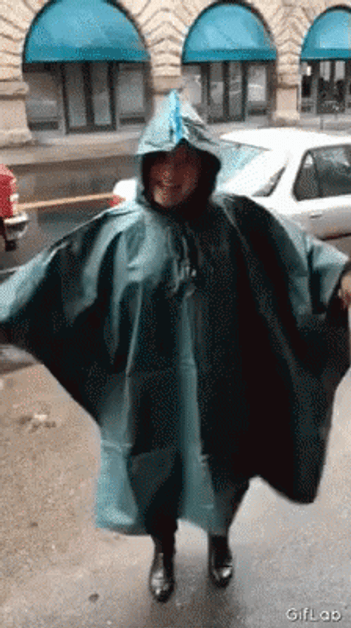 Funny Rain Dancing Lady Wearing Raincoat GIF