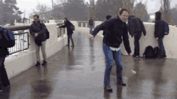 Funny Rain People Sliding On Slippery Road GIF