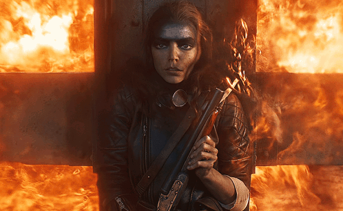 Furiosa Hiding Behind Big Fence GIF