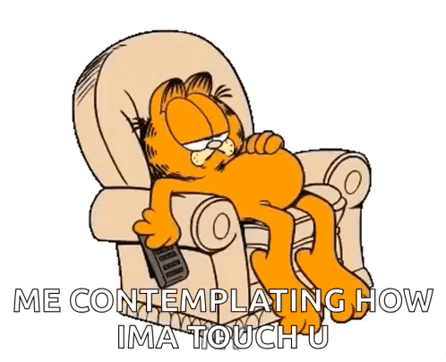 Garfield Is Laying In A Chair With A Remote Control In His Hand GIF