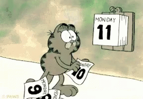 Garfield Is Looking At A Calendar That Says Monday On It GIF