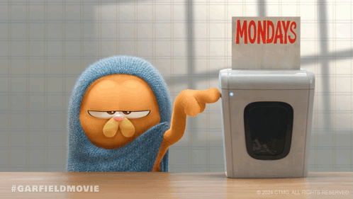 Garfield Is Pointing At A Washing Machine That Says Mondays GIF