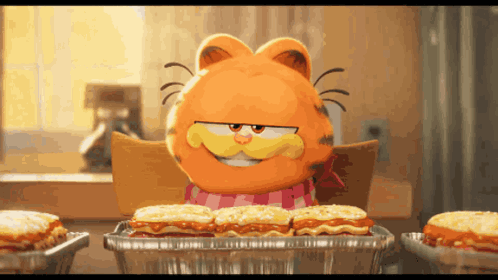Garfield Sits At A Table With A Tray Of Food GIF