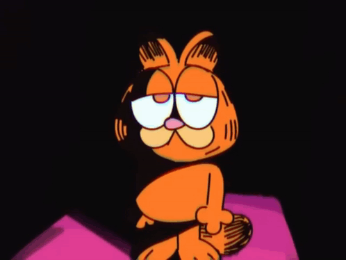 Garfield The Cat Is Sitting On A Pink Pillow With His Eyes Closed And A Sad Look On His Face . GIF