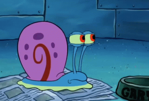 Gary The Snail From Spongebob Squarepants Is Laying On A Newspaper Next To A Dog Bowl GIF