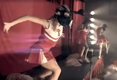 Gas Mask Cheerleader In White And Red GIF