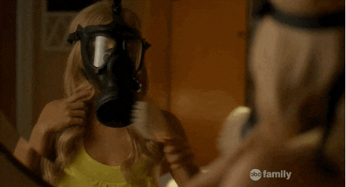 Gas Mask Woman Brushing Hair GIF