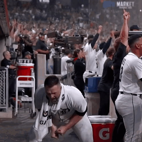 Gatorade Cooler Next to Baseball Player in Dugout