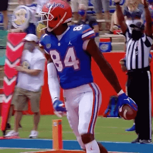 Gators Chest Bumping Players GIF
