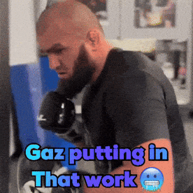Gaz Putting In That Work Written On Man's Arm GIF