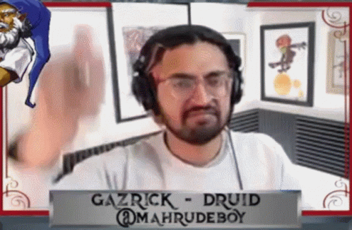 Gazrick Druid Wearing Headphones at Mahrudeboy Sign