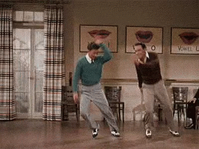 Gene Kelly Donald O'connor Performance Singing In The Rain GIF