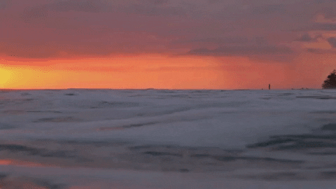 Gentle Ocean Waves At Sunset GIF