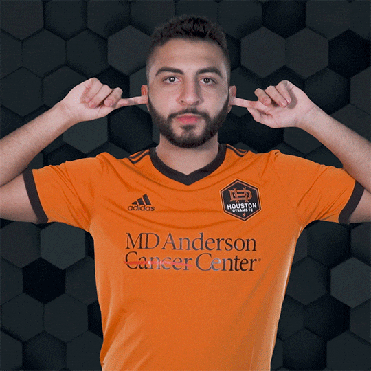 George Adamou Ear Plugs And Rock Sign For Pose GIF