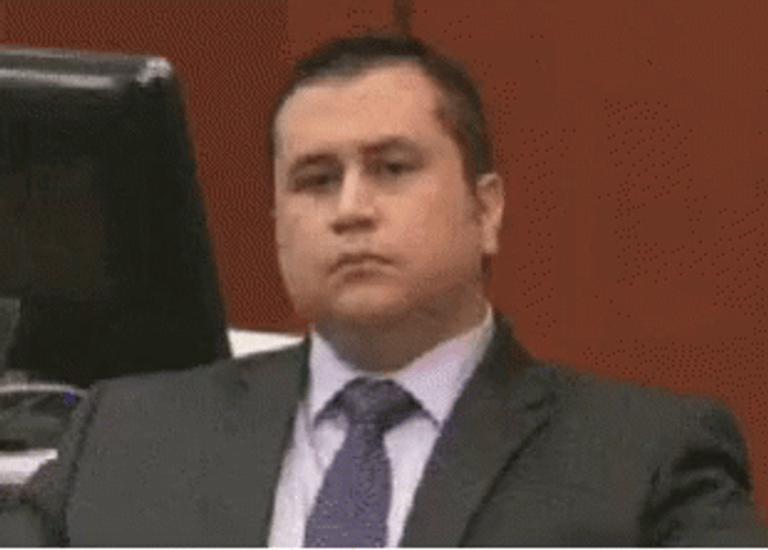 George Zimmerman Trying Not To Laugh GIF