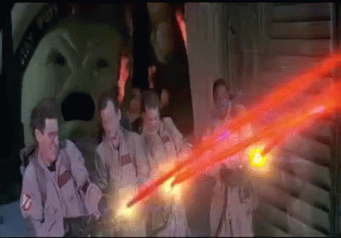Ghostbusters Standing In Dark Room With Red Light GIF
