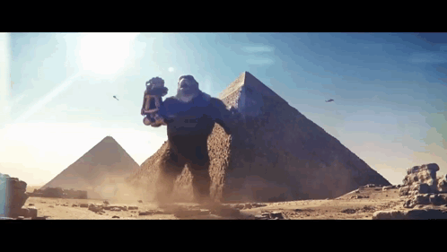 Giant Monster in Desert with Pyramid