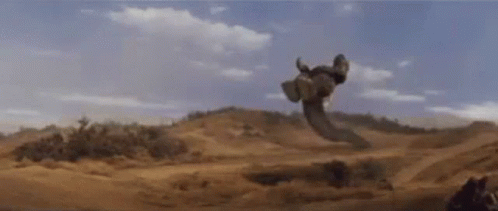 Giant Snake Flying In Desert GIF