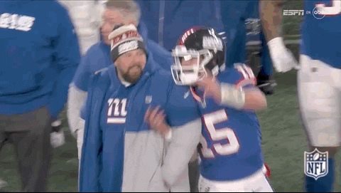Giants Player Helped Off Field By Man In Giants Hat GIF