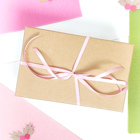 Gift Wrapped in Brown Paper With Pink Bow