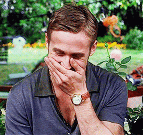 Giggling With Hand On Face GIF