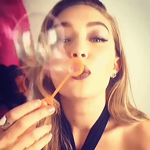 Gigi Hadid Blowing Bubbles GIF