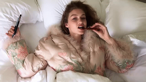 Gigi Hadid Eating While Lying Down GIF