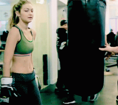 Gigi Hadid Hugging The Punching Bag GIF