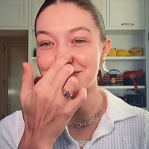 Gigi Hadid Squeezing Her Face GIF