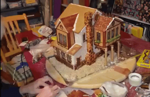 Gingerbread House Being Built GIF