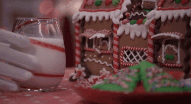 Gingerbread House Next To Milk GIF