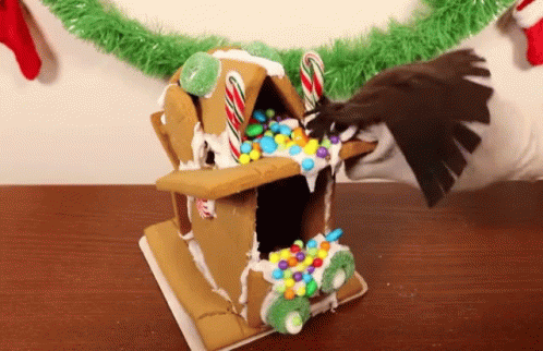 Gingerbread House With Candy Canes GIF
