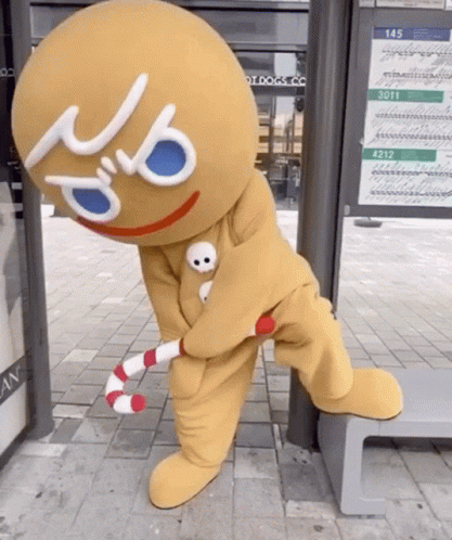 Gingerbread Man Holding Candy Cane GIF
