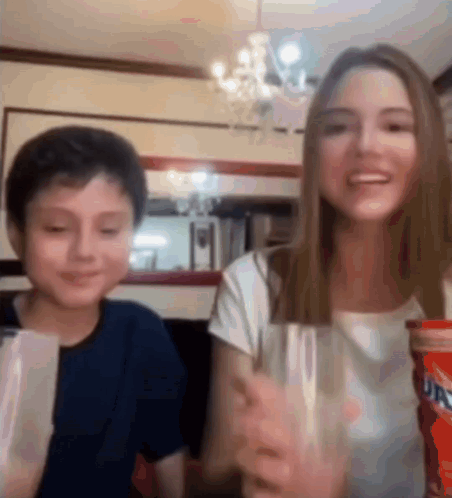 Girl and Boy Holding Soda Glasses