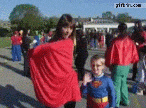 Girl and Boy in Superman Costumes