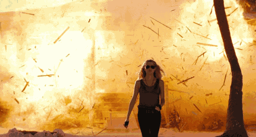 Girl Calm Walk Away From A Bomb Explosion GIF