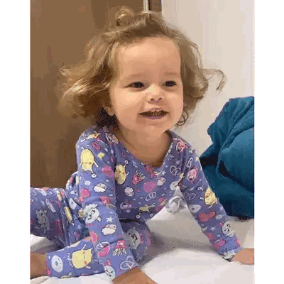 Girl Crawling in Purple Pajamas