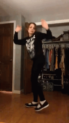 Girl Dancing In Room With Clothes GIF