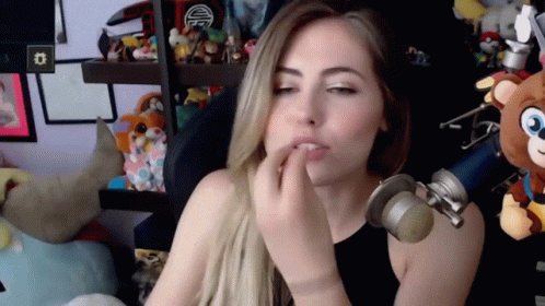 Girl Doing Chef's Kiss While Sitting GIF
