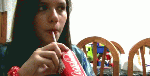 Girl Drinking Coca Cola Through Straw
