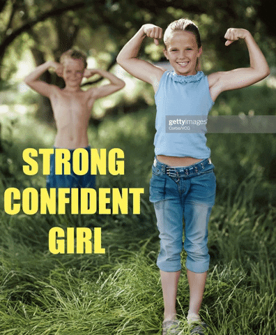 Girl Flexing Muscles in Front of Shirtless Boy