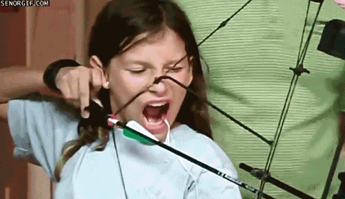 Girl Had A Missing Tooth On Archery GIF
